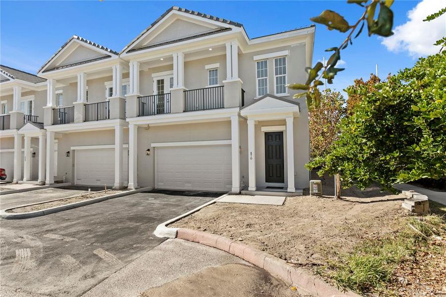 Front exterior of a new home in , St. Petersburg, FL, highlighting curb appeal (Image 1). Front exterior of a new home in , St. Petersburg, FL, highlighting curb appeal (Image 1).