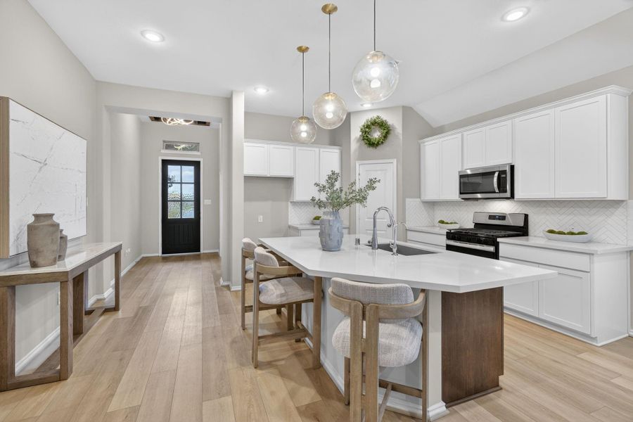 This is the kitchen with large island looking toward the front door. This is the kitchen with large island looking toward the front door.