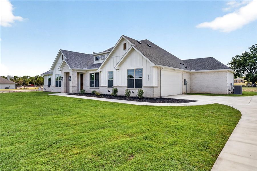 Front exterior of a new home in Taylor Ranch, Springtown, TX, highlighting curb appeal (Image 30).