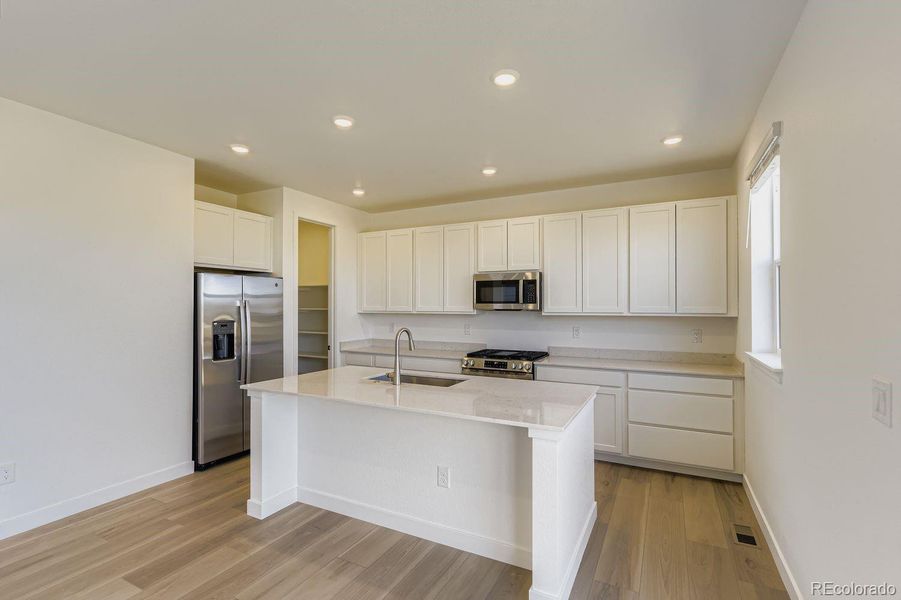 Furnished interior view inside a new home in Vermilion Creek: The Pioneer Collection, Centennial (Image 6).