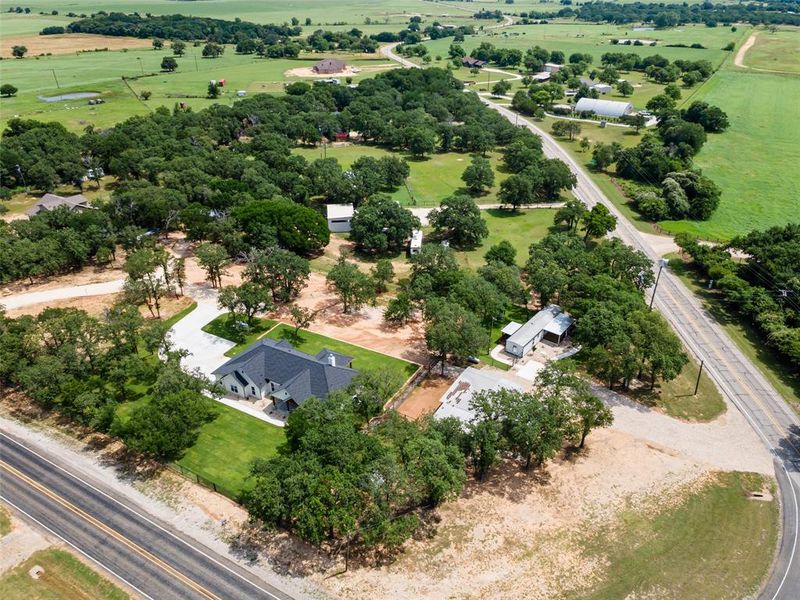 Front exterior of a new home in , Tolar, TX, highlighting curb appeal (Image 32). Front exterior of a new home in , Tolar, TX, highlighting curb appeal (Image 32).