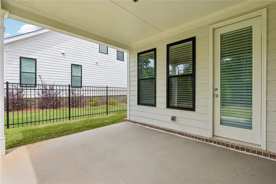Exterior details and patio area of a home in Promenade at Sawnee Village, Cumming (Image 4). Exterior details and patio area of a home in Promenade at Sawnee Village, Cumming (Image 4).