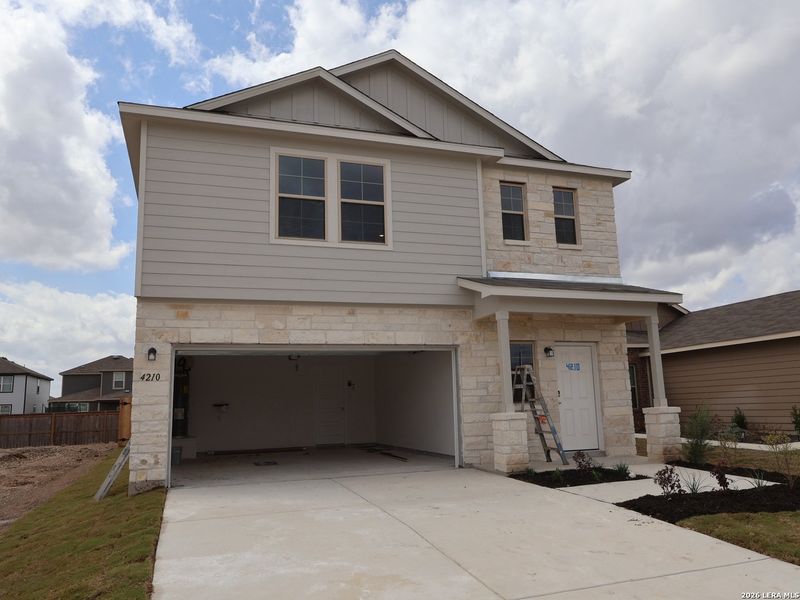 Front exterior of a new home in Park Place, New Braunfels, TX, highlighting curb appeal (Image 2). Front exterior of a new home in Park Place, New Braunfels, TX, highlighting curb appeal (Image 2).