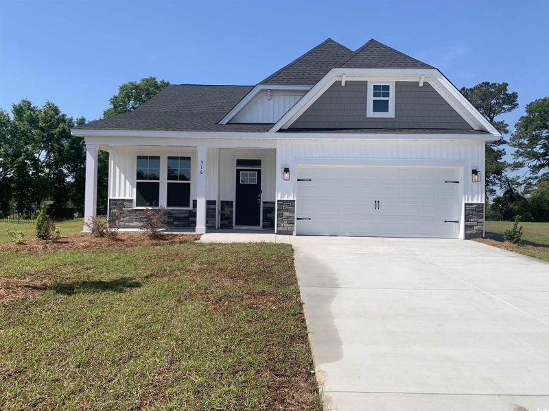Front exterior of a new home in Beach Gardens, Conway, SC, highlighting curb appeal (Image 1). Front exterior of a new home in Beach Gardens, Conway, SC, highlighting curb appeal (Image 1).