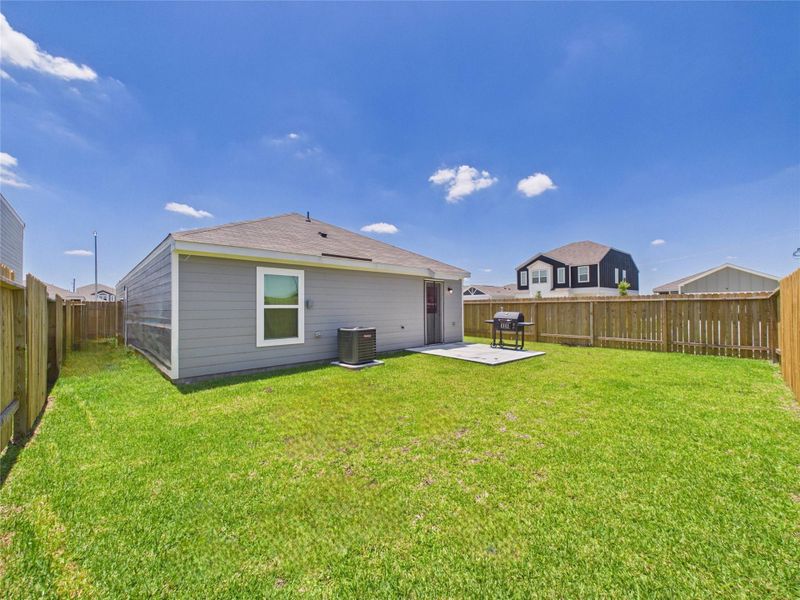 Exterior details and patio area of a home in Park Vista at El Tesoro, Houston (Image 4).