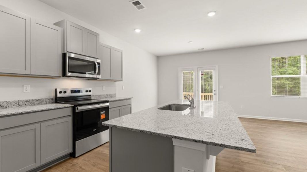 Furnished interior view inside a new home in Oaks at Cedar Grove, Fairburn (Image 8).