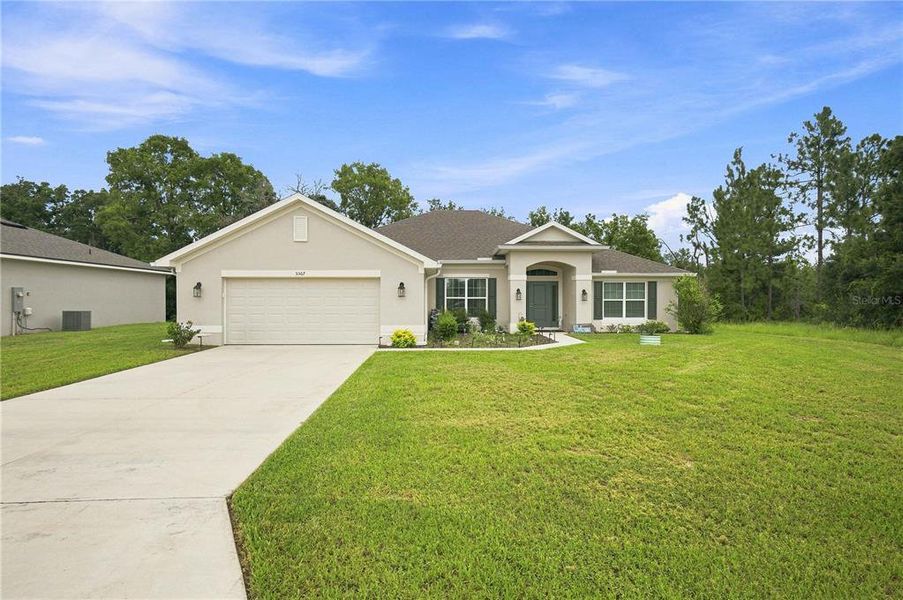 Front exterior of a new home in , Ocala, FL, highlighting curb appeal (Image 22). Front exterior of a new home in , Ocala, FL, highlighting curb appeal (Image 22).
