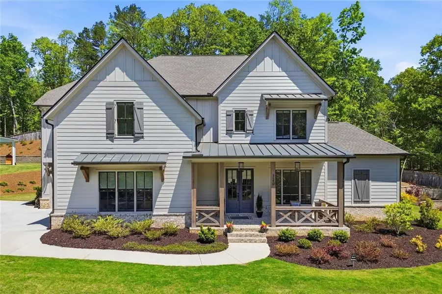 Front exterior of a new home in Malone's Pond, Ball Ground, GA, highlighting curb appeal (Image 25).
