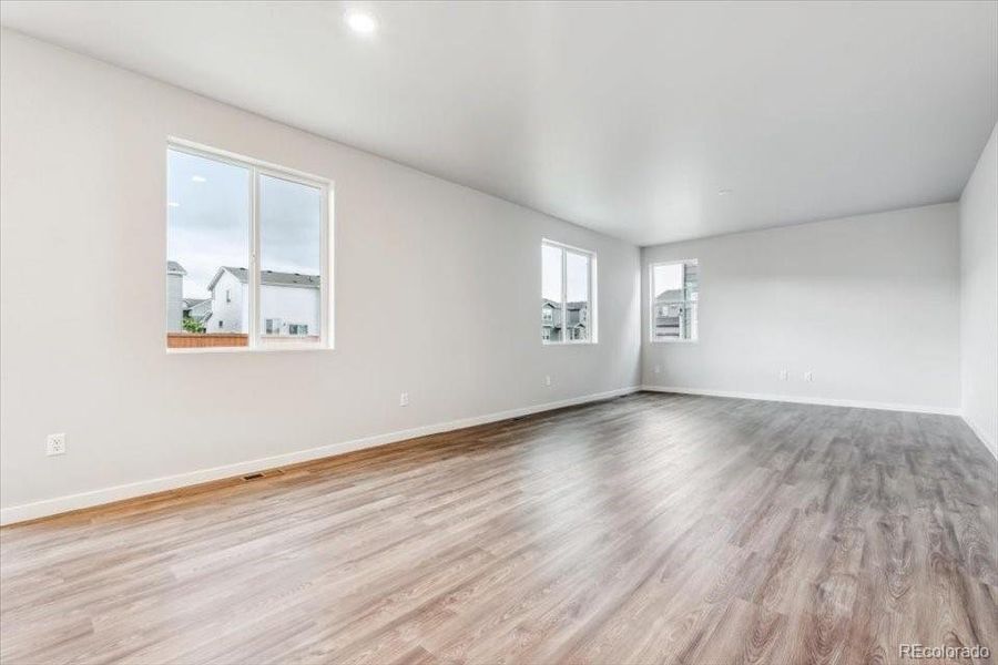 Spacious, unfurnished interior of a new home in The Haven II Collection  at Painted Prairie, Aurora (Image 12).