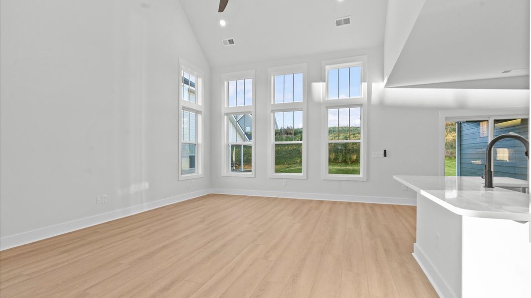 First-class living space featuring expansive ceilings, elegant design, and open sightlines to the kitchen