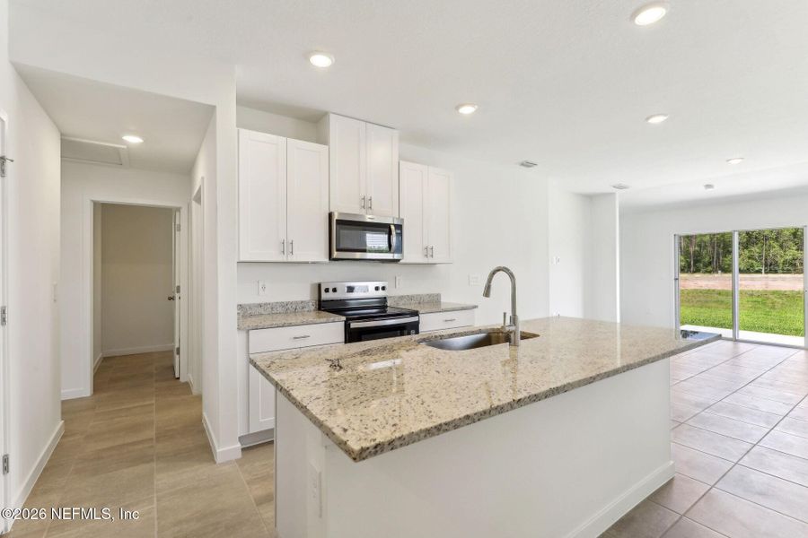 Furnished interior view inside a new home in Flagler Village - Classic Series, Palm Coast (Image 7).