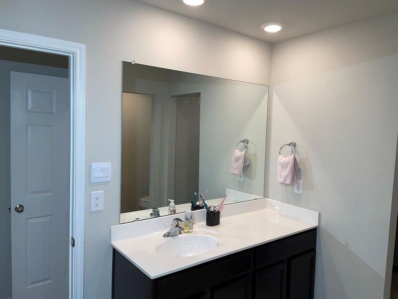 Bathroom with vanity and toilet