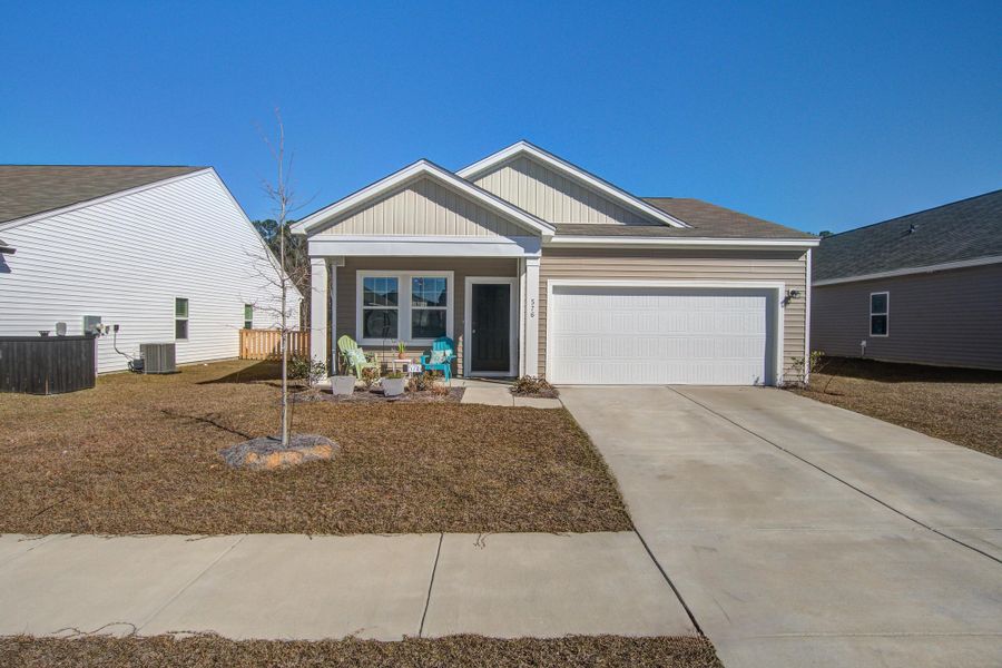 Front exterior of a new home in Pender Woods at Cane Bay, Summerville, SC, highlighting curb appeal (Image 24).