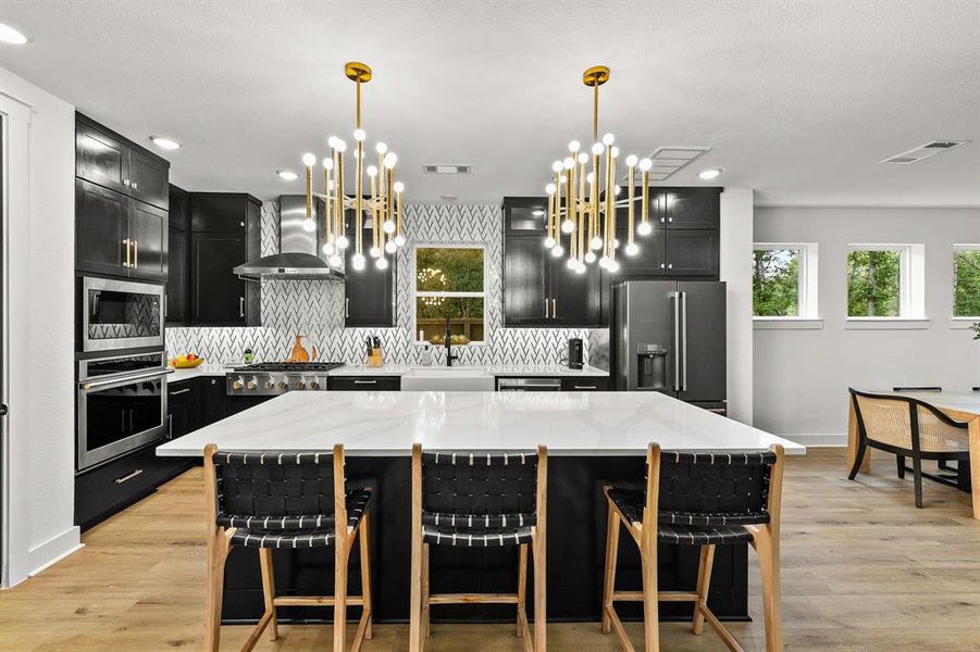 Upper level cabinets for ample storage and backsplash to the ceiling. Quartz countertops.