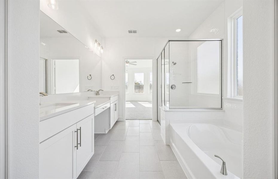 Luxurious owner's bath complete with double sinks and a generous shower Luxurious owner's bath complete with double sinks and a generous shower