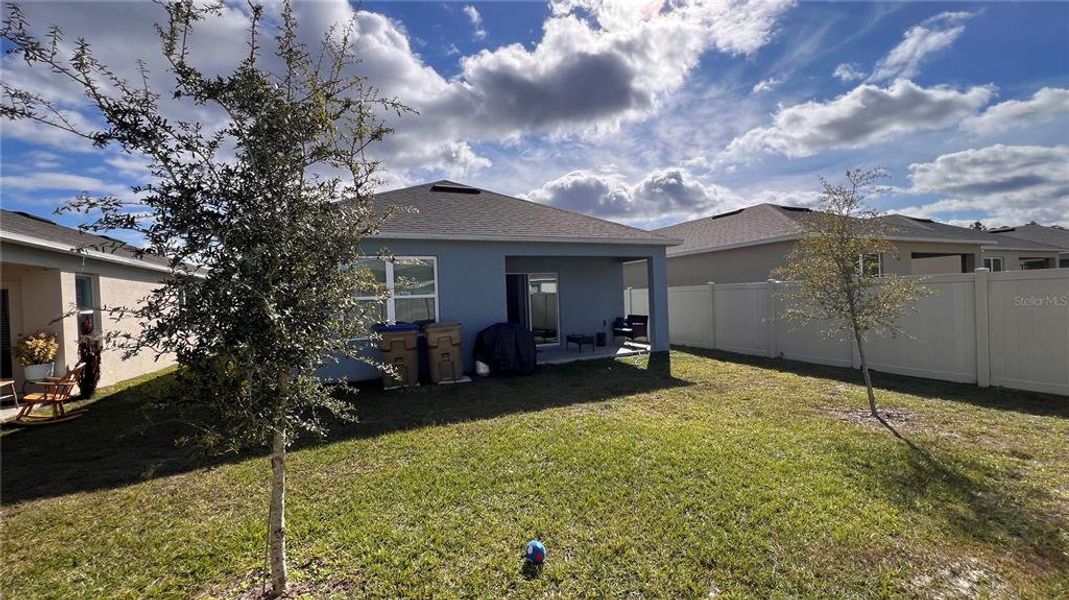 Exterior details and patio area of a home in Harmony West, St. Cloud (Image 4).