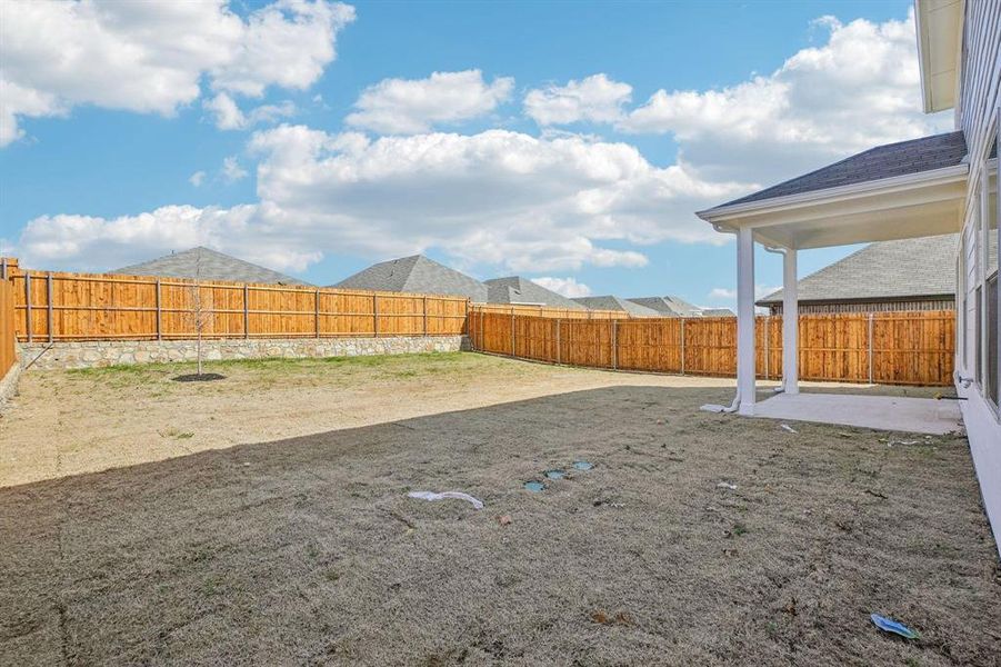 Fenced backyard with a patio Fenced backyard with a patio