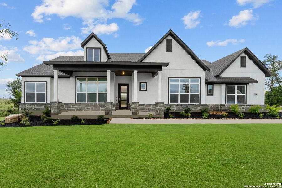 Front exterior of a new home in Megans Landing – Half-Acre Homesites, Castroville, TX, highlighting curb appeal (Image 2). Front exterior of a new home in Megans Landing – Half-Acre Homesites, Castroville, TX, highlighting curb appeal (Image 2).