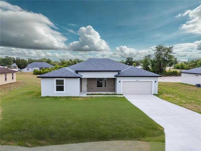 Front exterior of a new home in , Ocala, FL, highlighting curb appeal (Image 1). Front exterior of a new home in , Ocala, FL, highlighting curb appeal (Image 1).