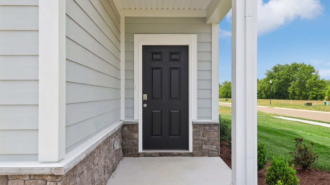 Covered Entryway to home with black door Covered Entryway to home with black door
