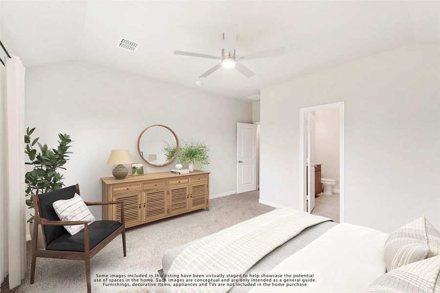Bedroom with carpet, ceiling fan, and ensuite bathroom doorway visible