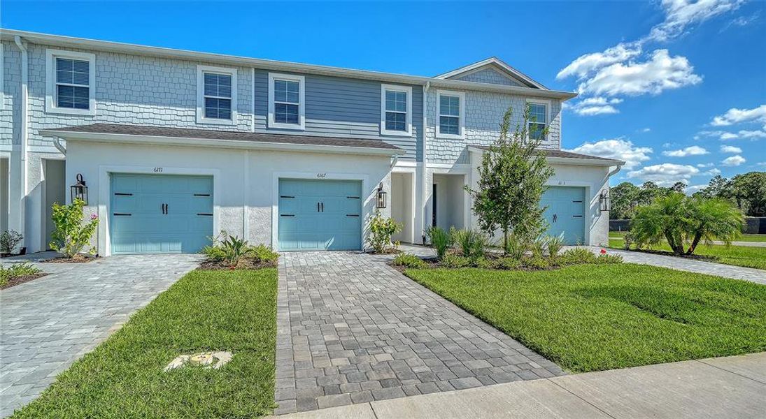 Front exterior of a new home in , Sarasota, FL, highlighting curb appeal (Image 2). Front exterior of a new home in , Sarasota, FL, highlighting curb appeal (Image 2).