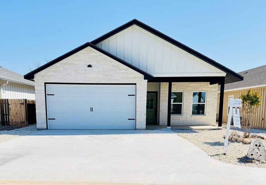 Front exterior of a new home in , Kerrville, TX, highlighting curb appeal (Image 1).