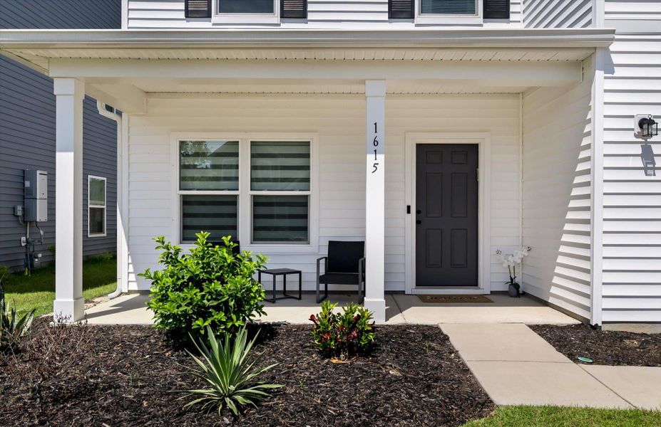 Front exterior of a new home in , Charleston, SC, highlighting curb appeal (Image 1).