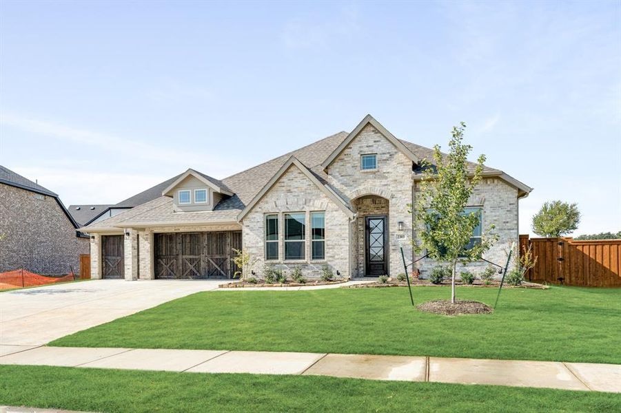 Front exterior of a new home in Rockwood 90, Mansfield, TX, highlighting curb appeal (Image 2). Front exterior of a new home in Rockwood 90, Mansfield, TX, highlighting curb appeal (Image 2).