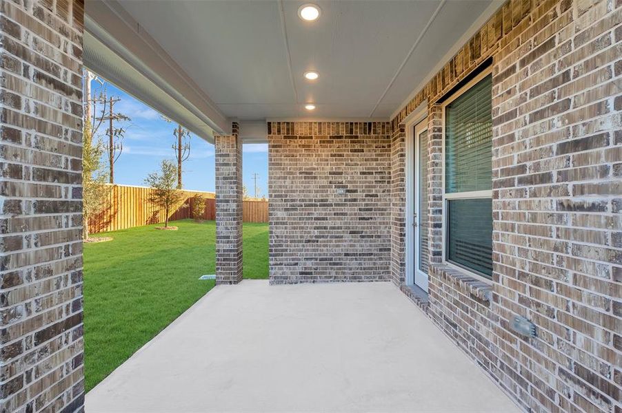 Exterior details and patio area of a home in Kreymer at the Park, Wylie (Image 24).