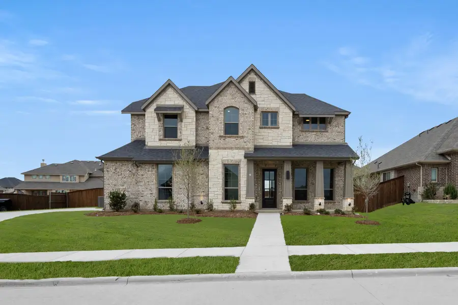 Front exterior of a new home in Hayes Crossing, Midlothian, TX, highlighting curb appeal (Image 1). Front exterior of a new home in Hayes Crossing, Midlothian, TX, highlighting curb appeal (Image 1).