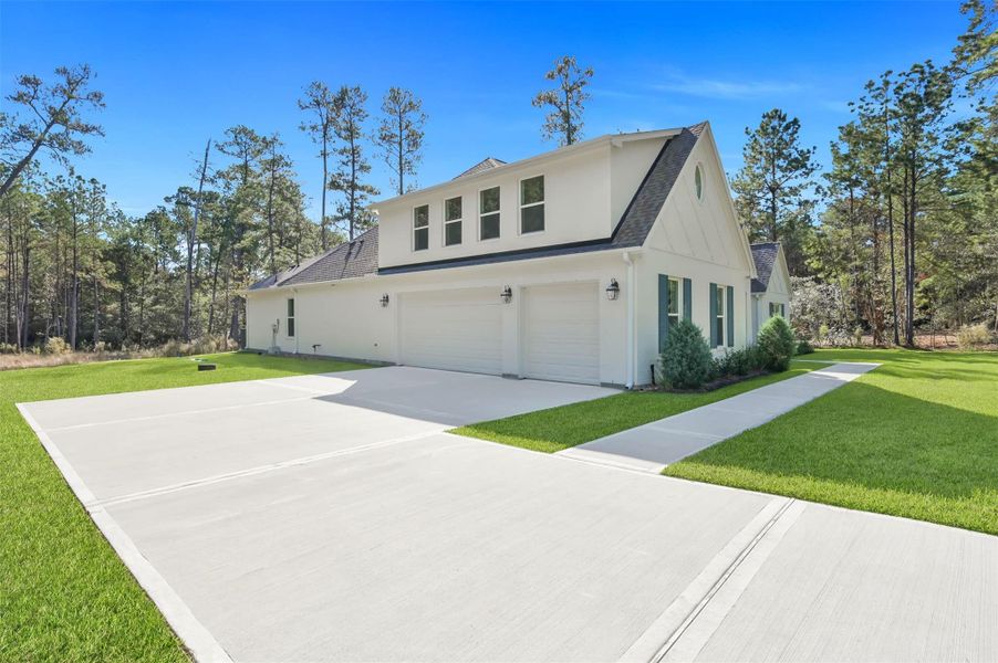 Fabulous design has 3-car garage with doors on side of home to not detract from front of home. Fabulous design has 3-car garage with doors on side of home to not detract from front of home.