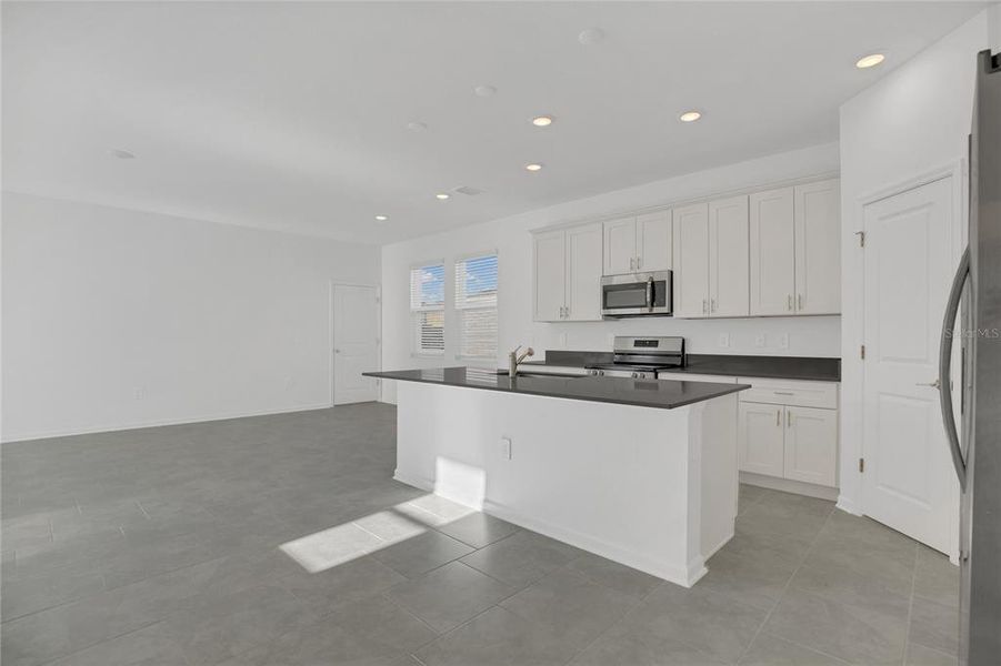 Furnished interior view inside a new home in Rhett's Ridge: Estates Alley Collection, Apopka (Image 5). Furnished interior view inside a new home in Rhett's Ridge: Estates Alley Collection, Apopka (Image 5).