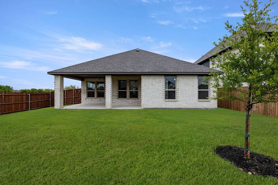 Representative exterior photo of a completed home built from the Winchester by Impression Homes in Timberbrook, Justin, TX (Image 25).