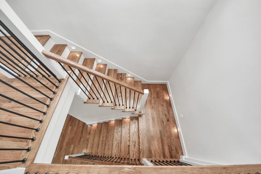custom lighting was added around the real hardwood stairs. custom lighting was added around the real hardwood stairs.