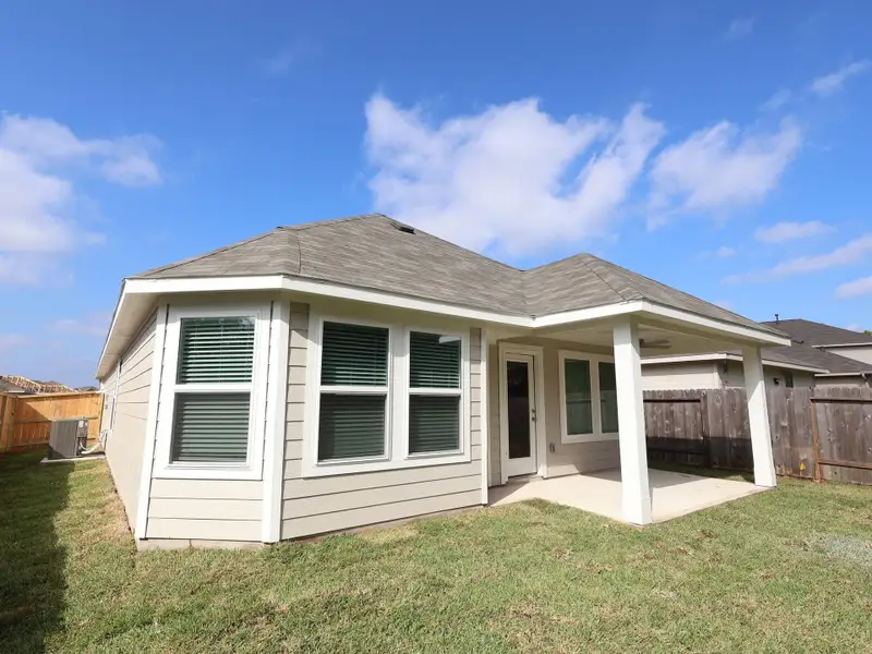 Exterior details and patio area of a home in Magnolia Ridge, Magnolia (Image 3).
