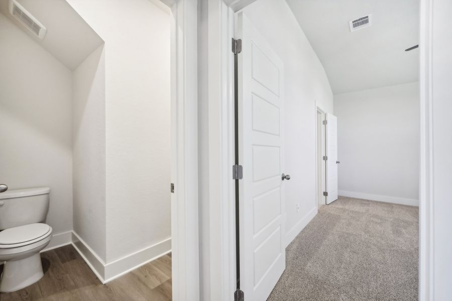 Primary suite bathroom in the Medina floorplan at a Meritage Homes community.