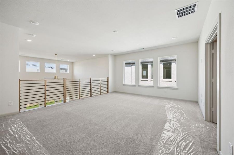 Great family fun times are waiting to be had in this over the top game room that overlooks the main floor family room!