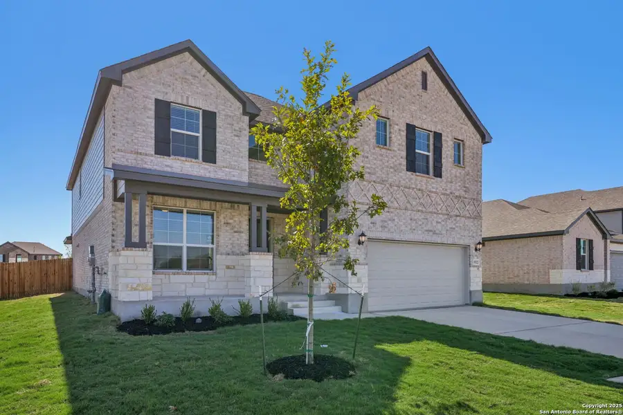 Front exterior of a new home in Carmel Ranch, Schertz, TX, highlighting curb appeal (Image 1).