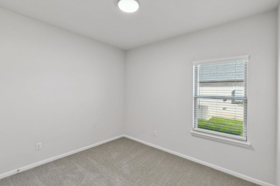 Bedroom in the Holden home plan by Trophy Signature Homes – REPRESENTATIVE PHOTO Bedroom in the Holden home plan by Trophy Signature Homes – REPRESENTATIVE PHOTO