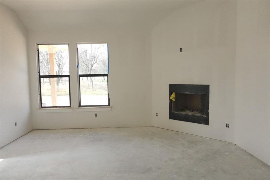 Unfurnished living room with concrete flooring