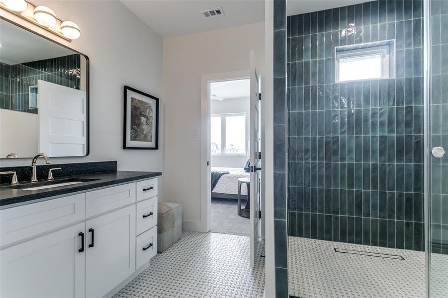 Bathroom featuring tile floors and vanity