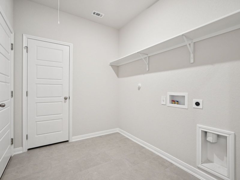 Laundry room in the Briscoe floorplan at a Meritage Homes community. Laundry room in the Briscoe floorplan at a Meritage Homes community.