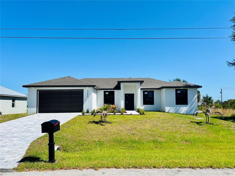 Front exterior of a new home in , Port Charlotte, FL, highlighting curb appeal (Image 29).