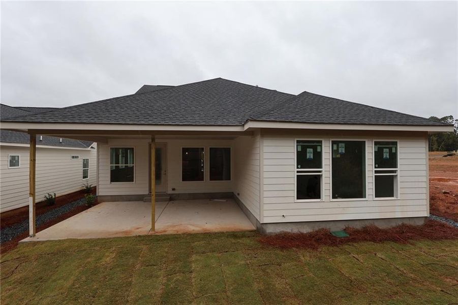 Exterior details and patio area of a home in Maple Grove at Towne Lake, Woodstock (Image 1).