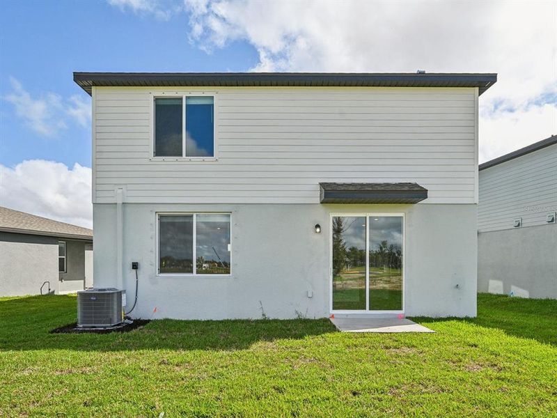 Exterior details and patio area of a home in Oakfield Trails - Signature Series, Parrish (Image 22).