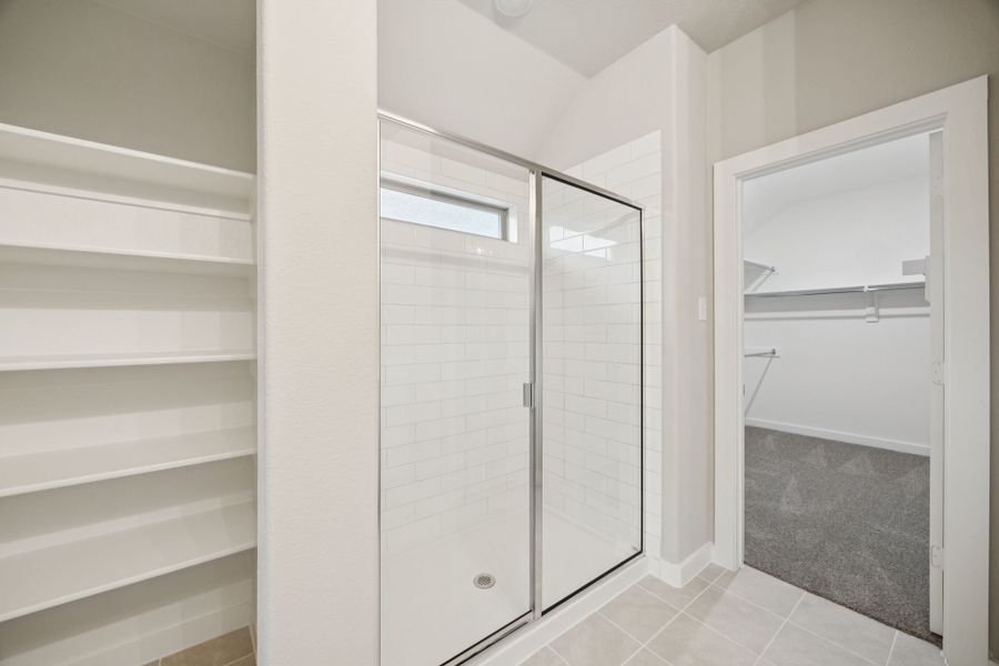 Primary Bathroom in the Oscar home plan by Trophy Signature Homes – REPRESENTATIVE PHOTO