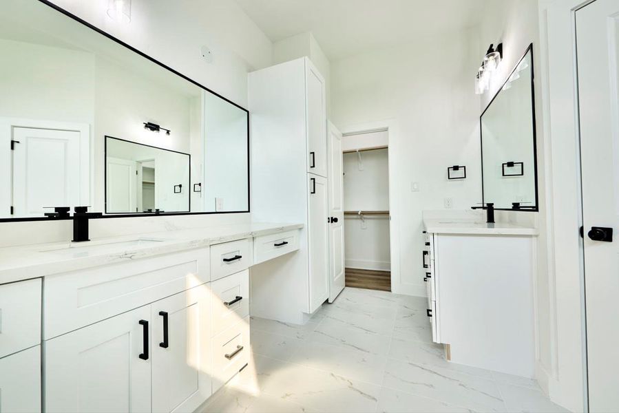 Designed for comfort and convenience, the primary bathroom features double sinks with sleek, modern fixtures. The spacious vanity area offers ample storage, making it a perfect blend of style and function. Designed for comfort and convenience, the primary bathroom features double sinks with sleek, modern fixtures. The spacious vanity area offers ample storage, making it a perfect blend of style and function.