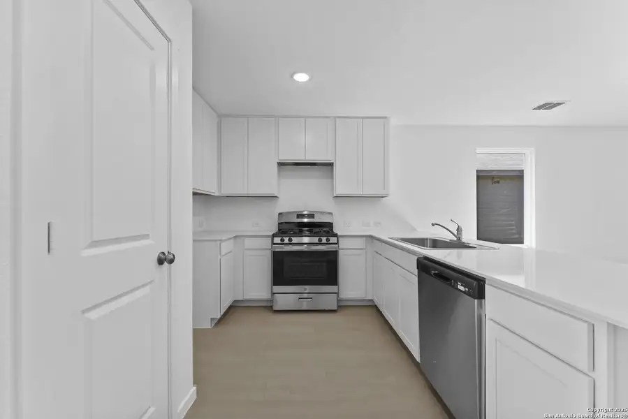 Furnished interior view inside a new home in Randolph Crossing: Cottage Collection, Converse (Image 6).