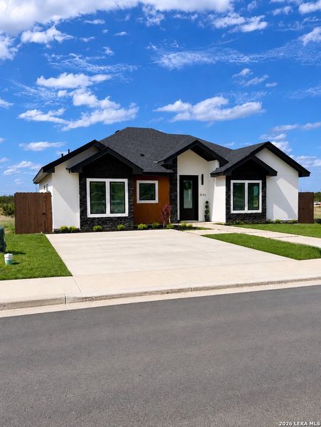 Front exterior of a new home in , Eagle Pass, TX, highlighting curb appeal (Image 26).